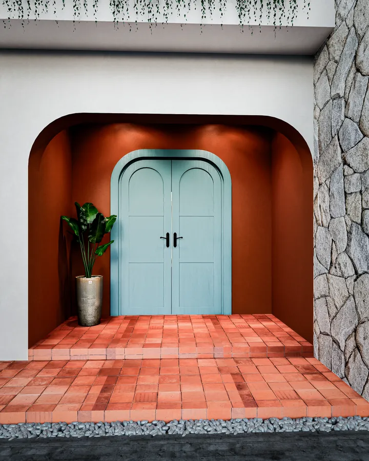 casa mf: entrada com porta azul em arco, nicho terracota e piso cerâmico